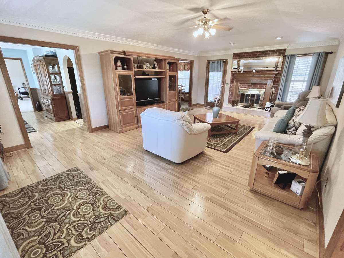Entertain with ease in the open floorplan, where the seamless flow between kitchen, dining, and living spaces creates the perfect setting for gatherings of any size.