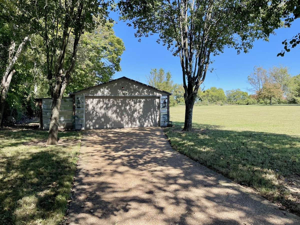 The detached garage is a fantastic bonus for anyone seeking EXTRA STORAGE or HOBBY SPACE while enjoying the property’s spacious, country-like setting.