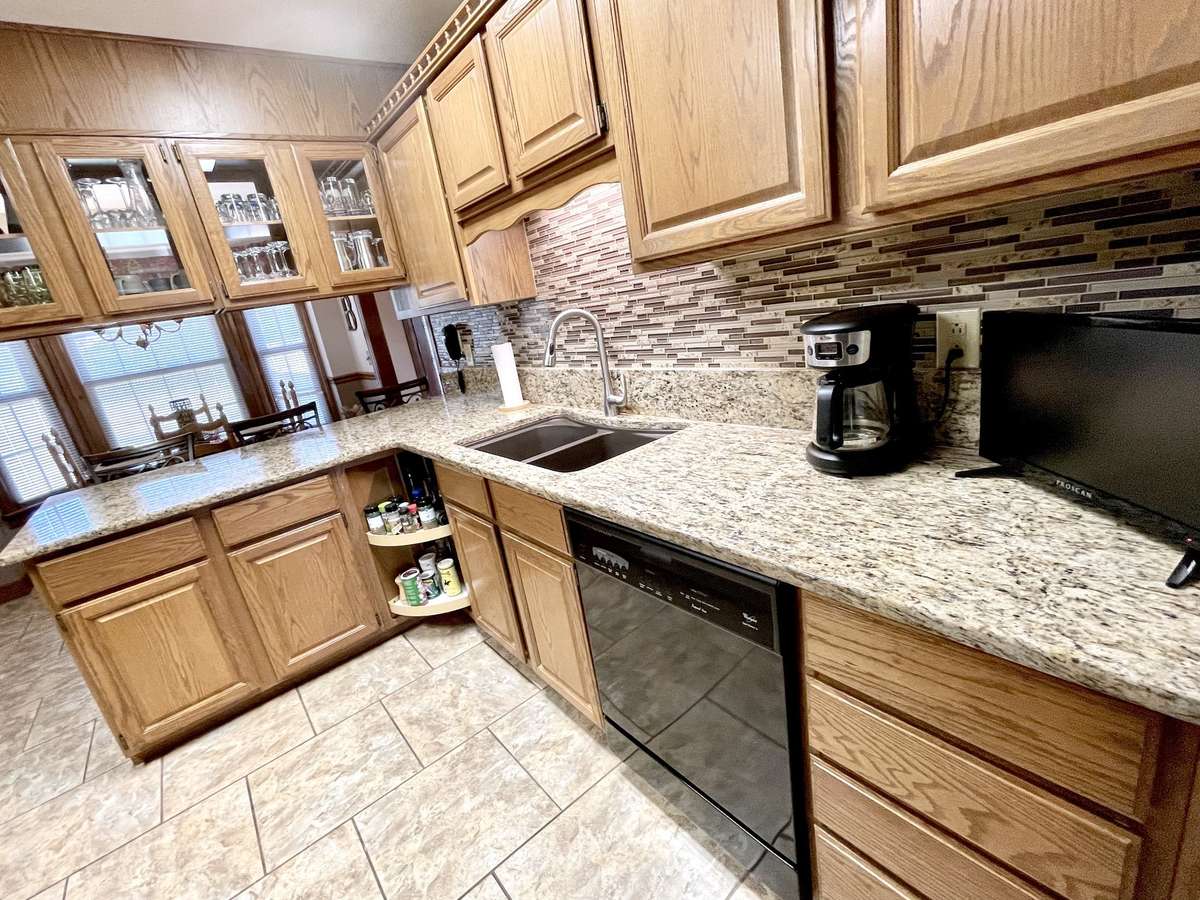 Ample cabinet and drawer storage with lazy suzan and pantry.