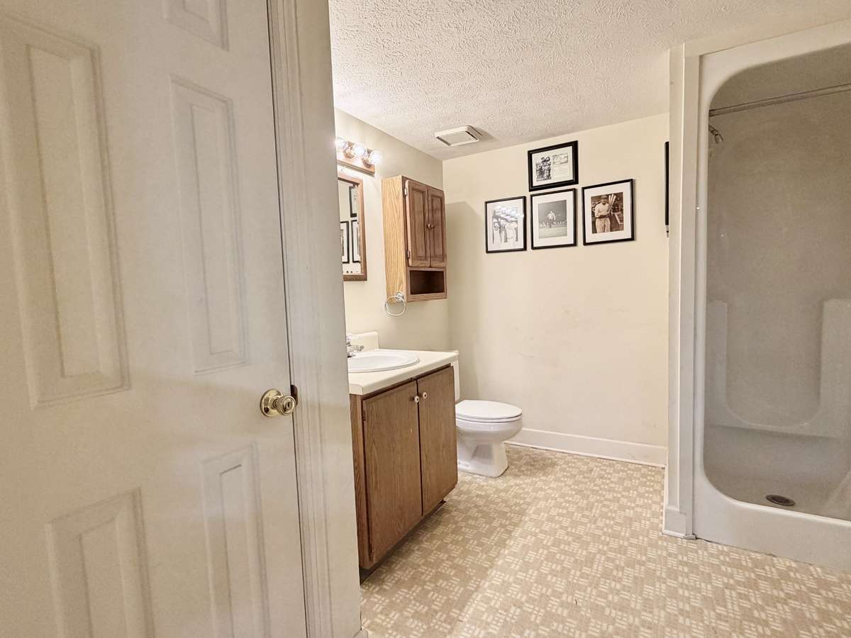 Basement equipped with full bath with shower & large linen storage closet.