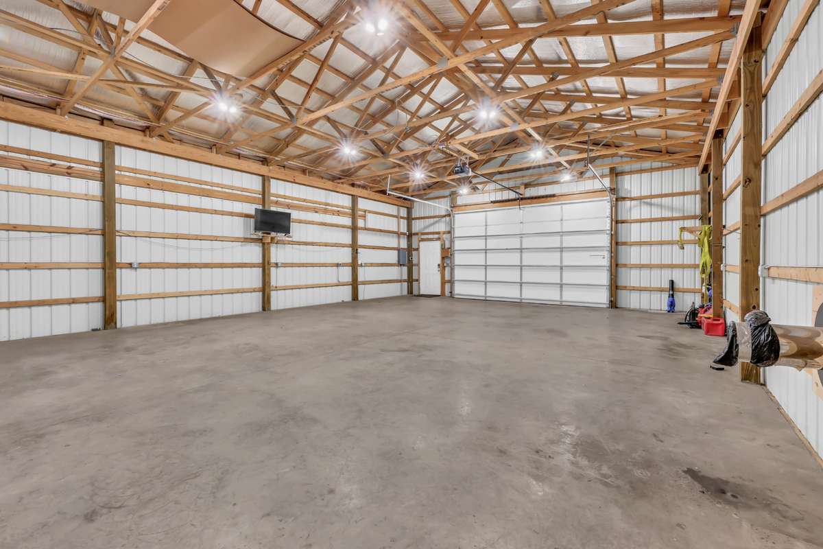 The overhead door is 10 ft. high and 16 ft. wide, and can secure vehicles from storms.