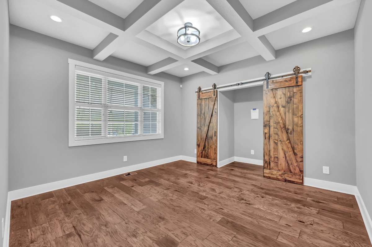 Separate office with wood flooring, reinforced floor area in the closet for heavy cabinets.