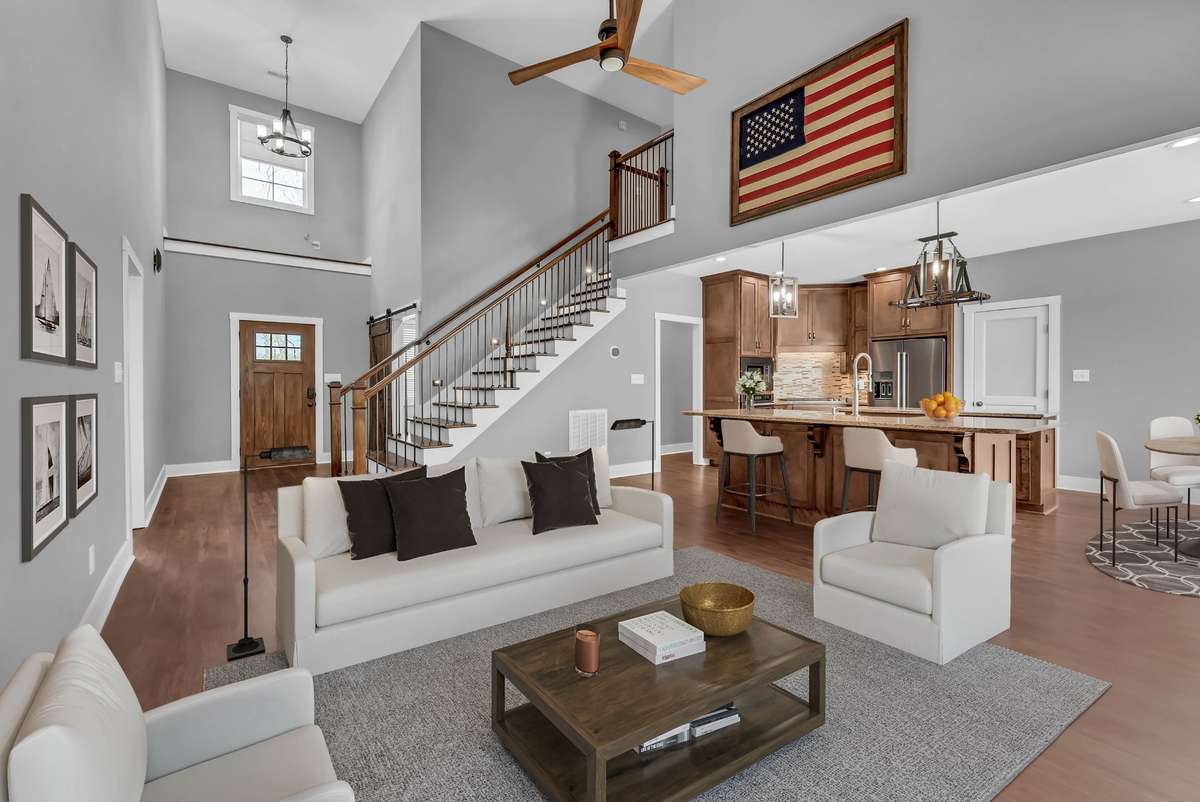 Virtually staged great room: Comfortable open living between the great room and the kitchen.