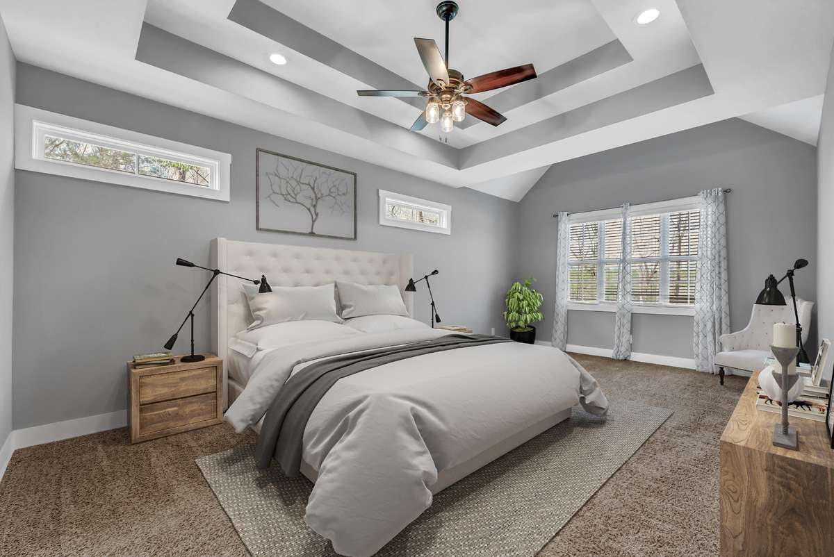 Virtually staged: The primary bedroom is delightfully roomy, with space for a sitting area and large pieces of furniture.
