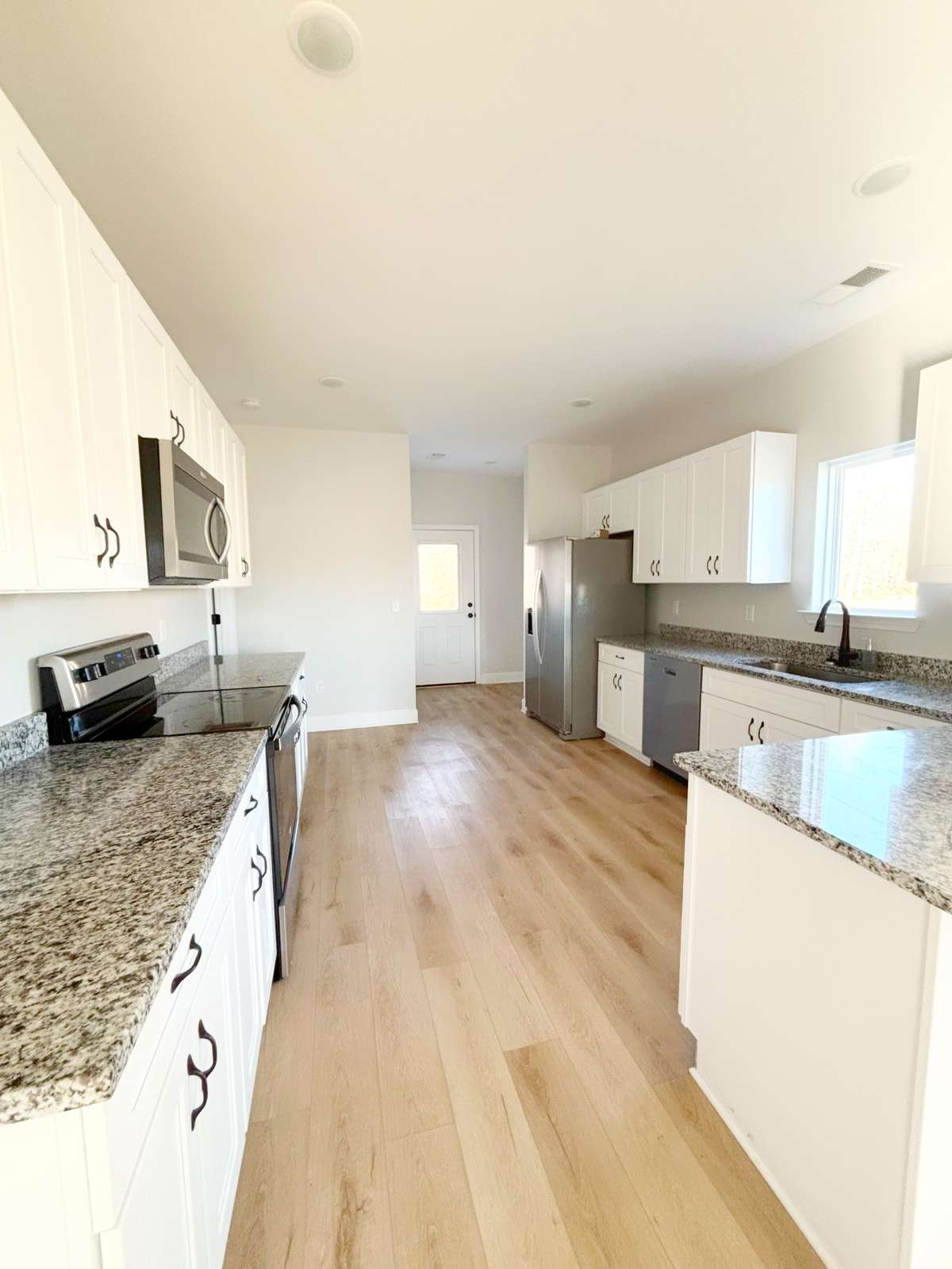 Large kitchen-stainless steel appliances-ample counter and cabinet space