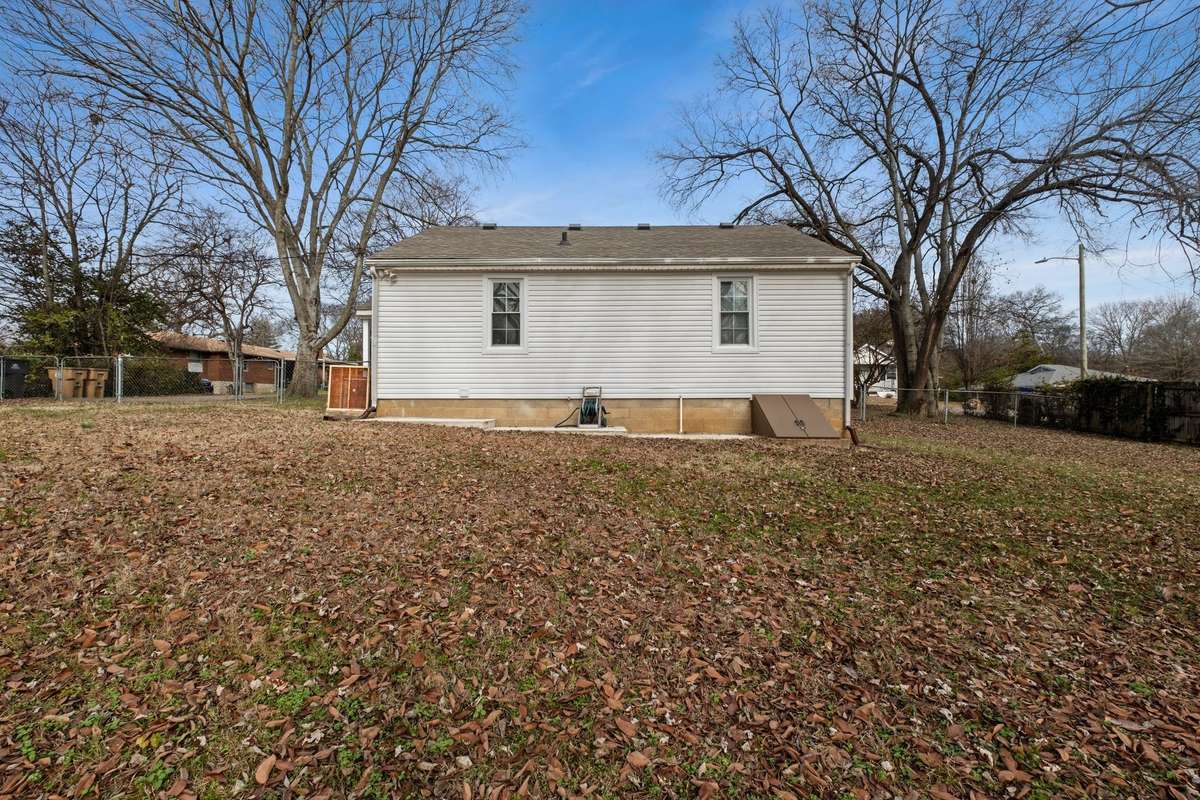 Back of home! Basement crawl space on right side of home!