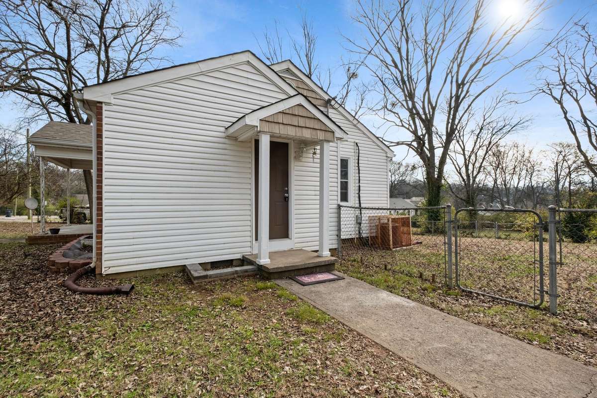 Side porch into kitchen!  Concrete sidewalk leading from driveway into home!  EZ to get the groceries or kiddos in!