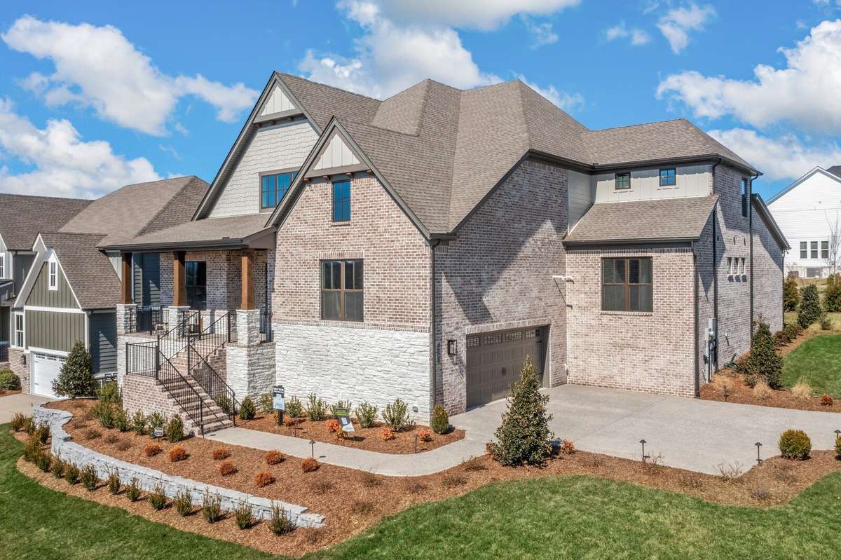 Enjoy beautiful sunset views from the front porch of this home which overlooks green, open space.