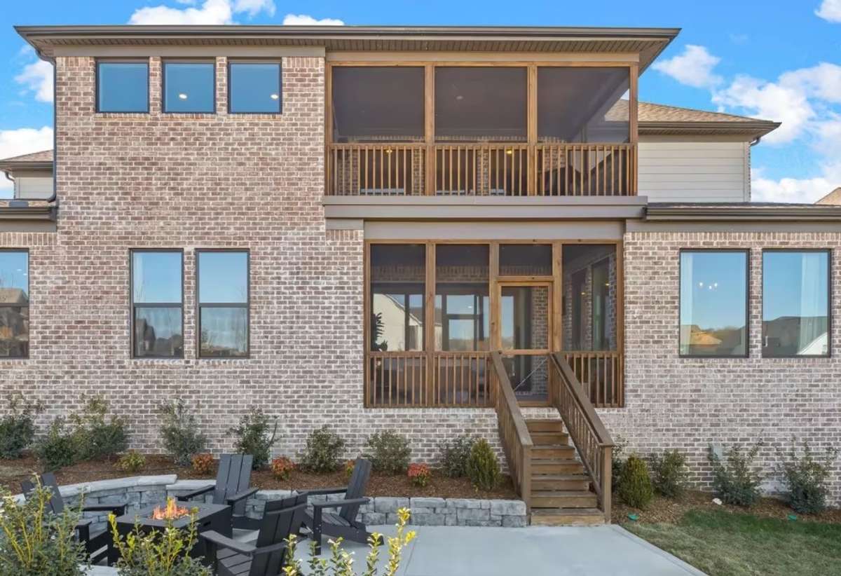 A first floor outdoor living area is located off of the Family and Dining rooms. The second story, screened in deck, is enjoyed off of the Game room. A beautiful outdoor patio with stone surround is found off of the covered porch.