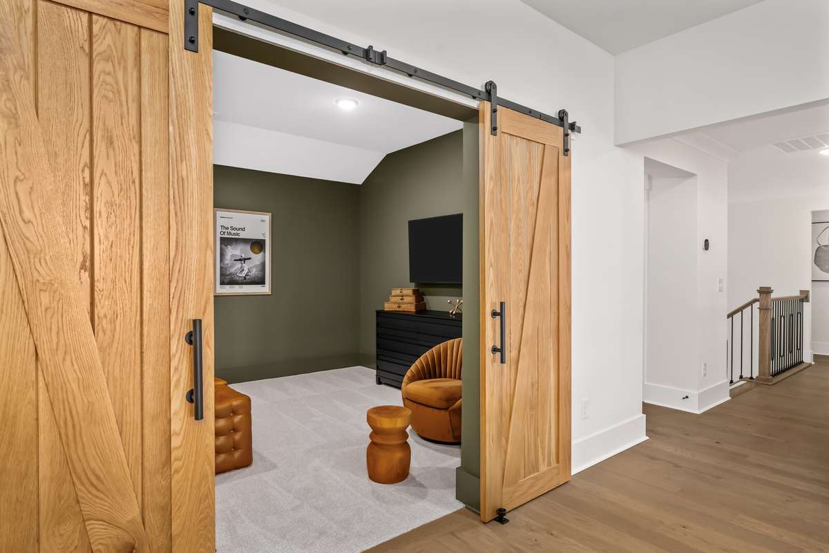 Barn doors lead to the Media room