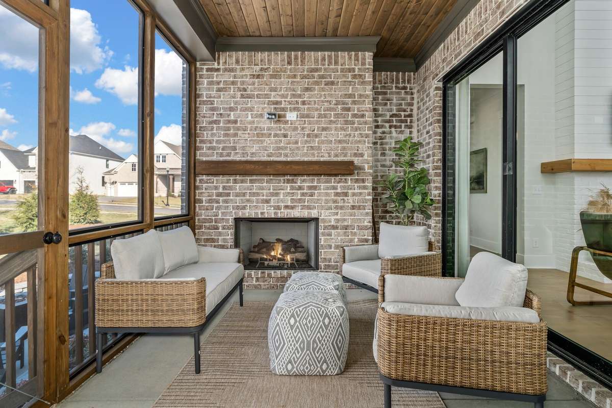 This first floor covered porch is located off of the Family room. A large, three panel sliding door separates the indoors from the outdoors.