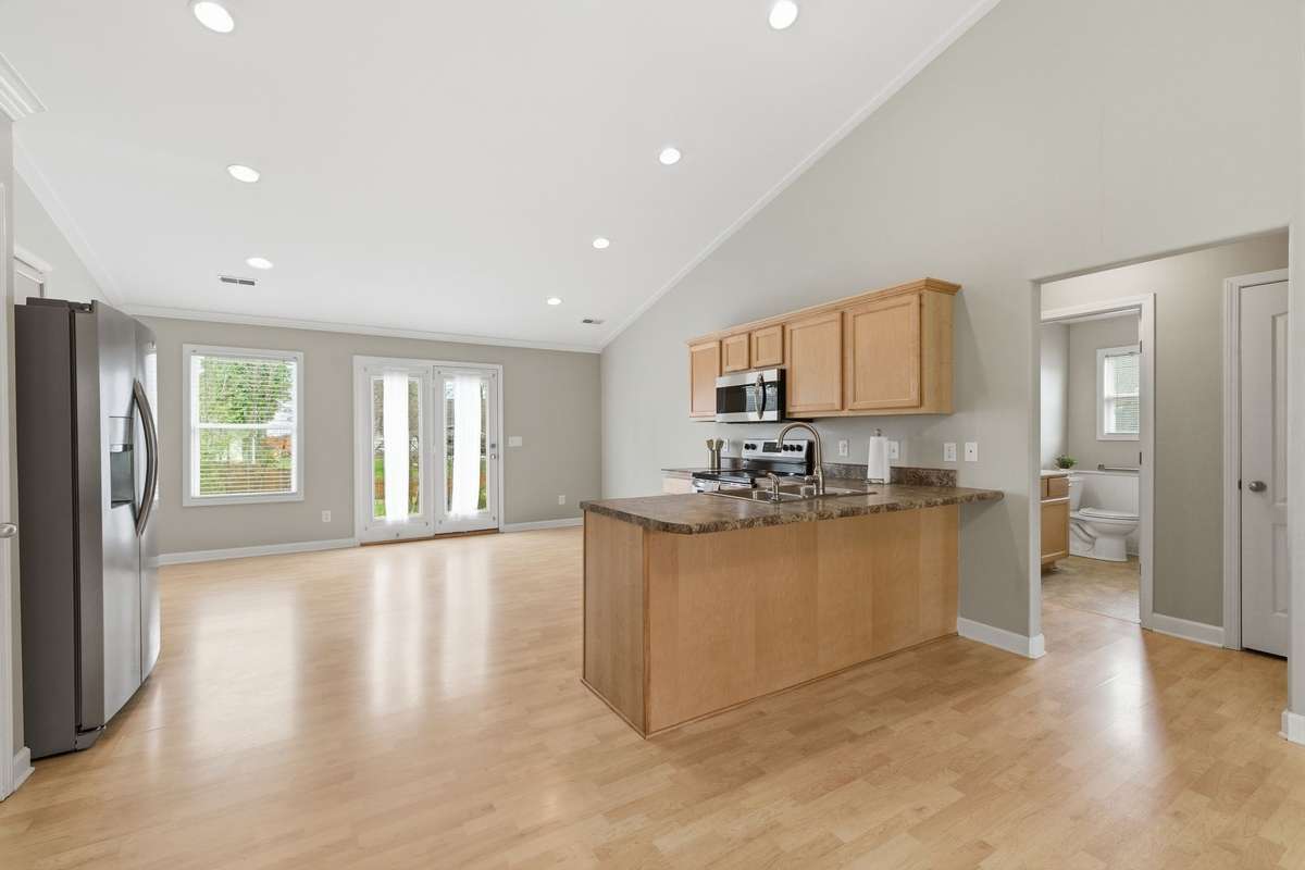 On the left side of the house is the primary bedroom and suite with laundry and on the right side is that two other bedrooms