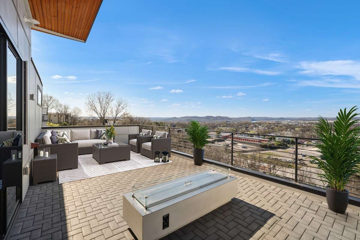 Incredible rooftop balcony with firepit on back of home with view of the Cumberland RIver