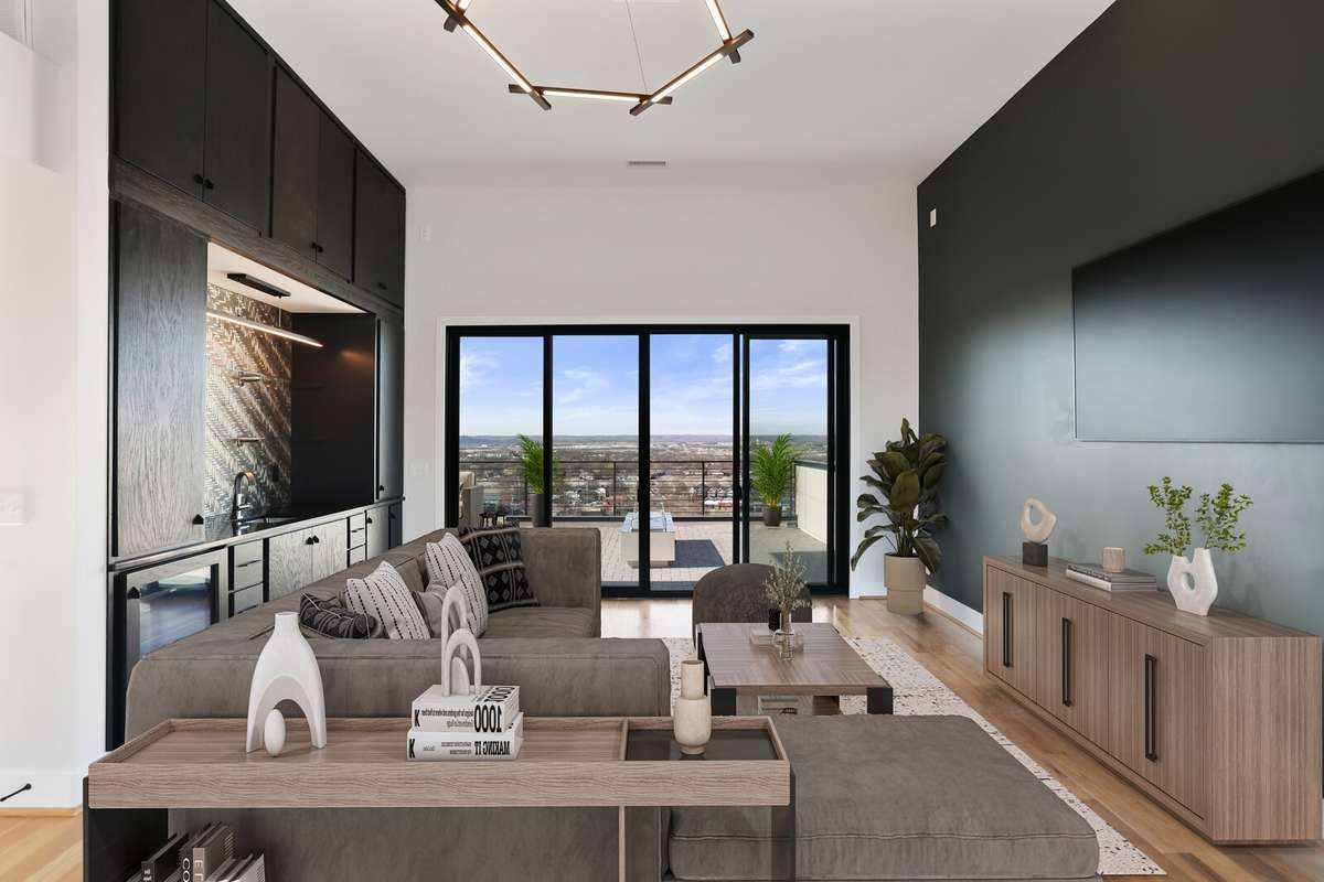 Top floor rec room or 4th bedroom wet bar with mini fridge, sink, and ice machine. Double balconies on front and back of home.