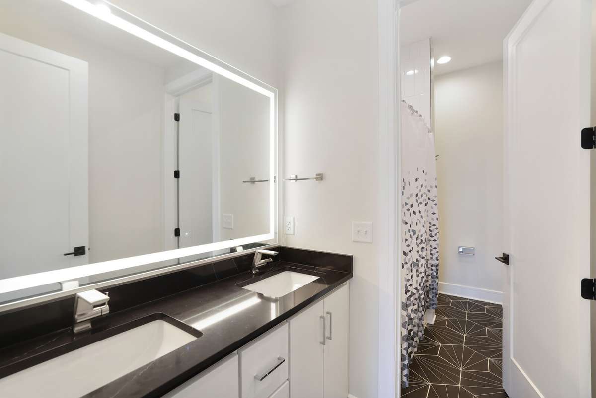 Second floor full bath with double sinks, tub shower