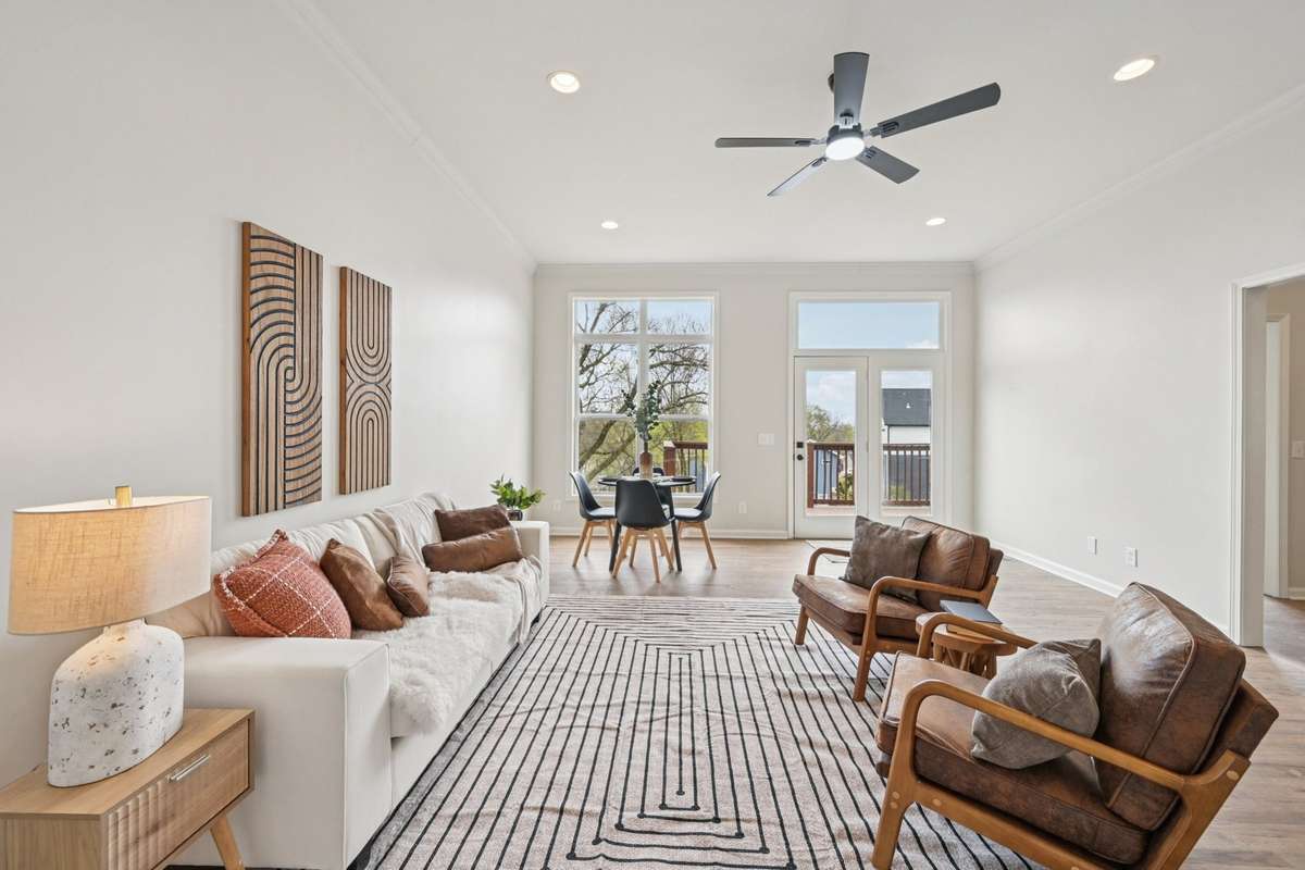 Living room with tons of natural light and direct access to back deck
