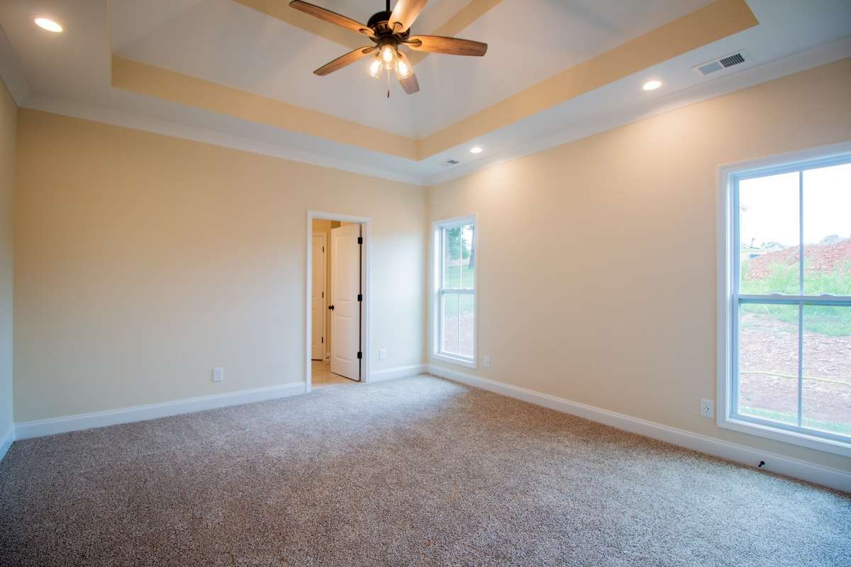 EXAMPLE>>>Primary Bedroom Features a Double Tray Ceiling, Recessed Lighting, Crown Molding and Three Walk-in Closets!!