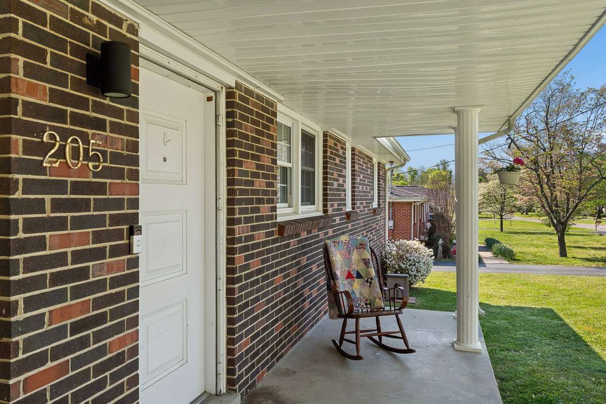 Enjoy your front porch looking out your large front lawn