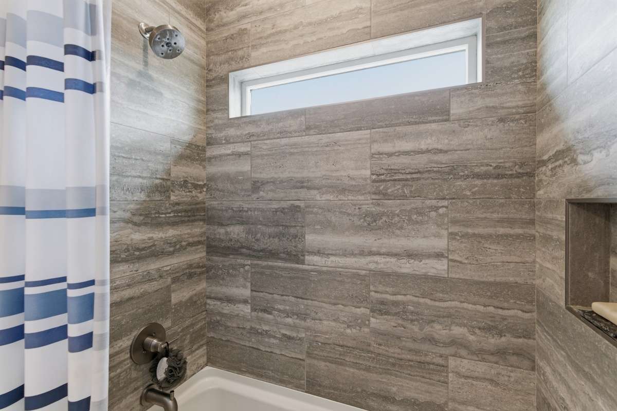 The abundant natural light transforms your morning shower into a spa-like experience!