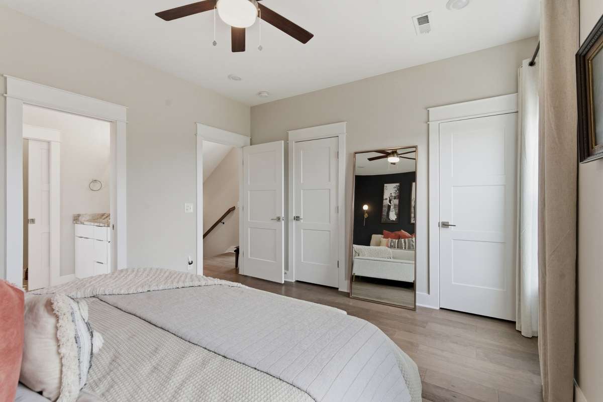 Multiple closets with custom built-ins provide ample storage space.