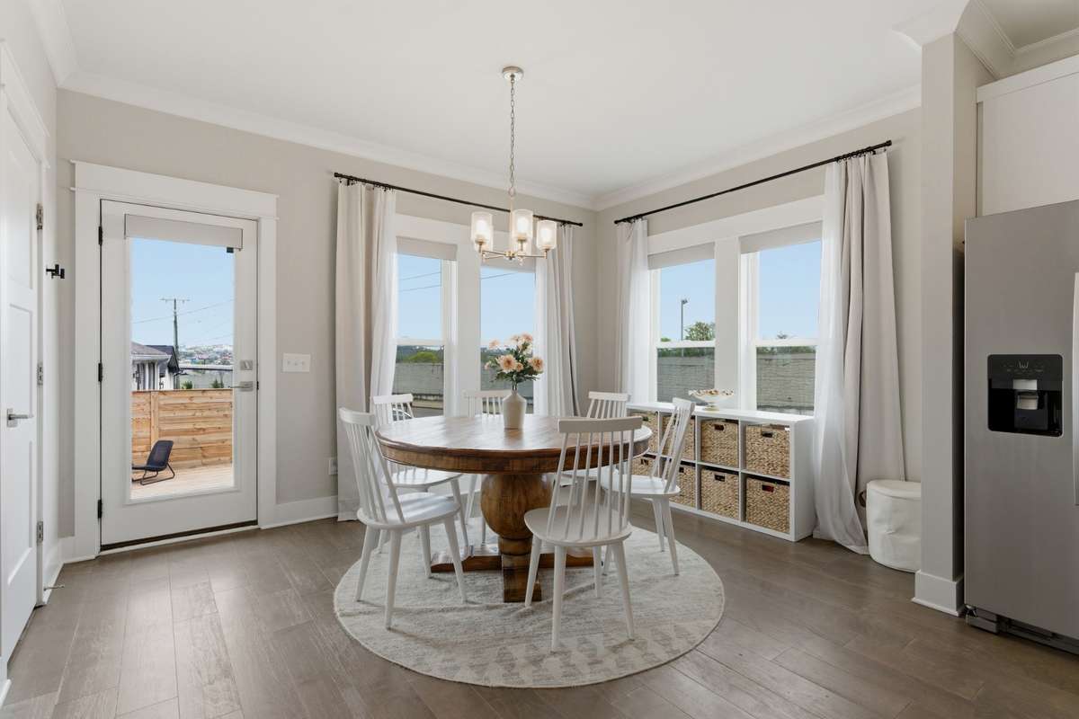 Floor-to-ceiling windows fill the dining room with natural light!