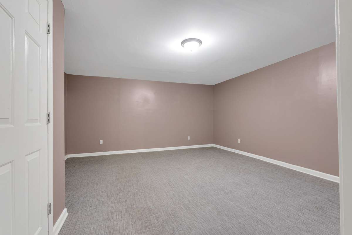 Fifth bedroom with neutral color scheme & large closet. 645 Wildwood Trace, Winchester, TN 37398