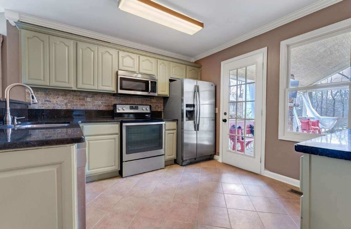 Highly functional kitchen with granite countertops and stainless steel appliances included! 645 Wildwood Trace, Winchester, TN 37398