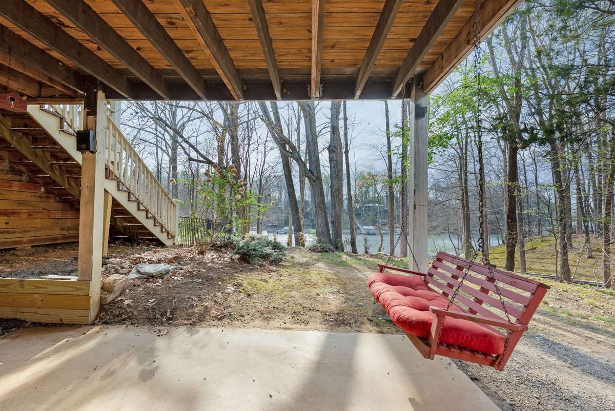 Head out from your basement to find a peaceful covered patio with swing. 645 Wildwood Trace, Winchester, TN 37398