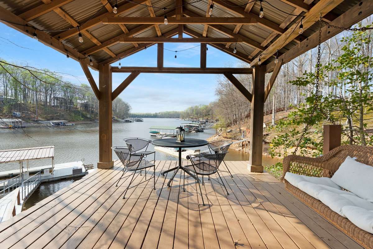 Your private covered dock area is the perfect space for outdoor entertaining with metal roof & string lights enjoy relaxing lakeside. 645 Wildwood Trace, Winchester, TN 37398