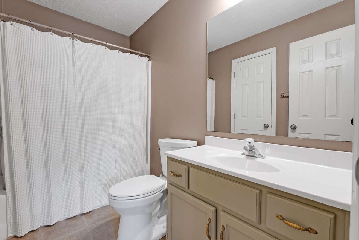 Private bath with single vanity, tile floors & combo tub & shower. 645 Wildwood Trace, Winchester, TN 37398