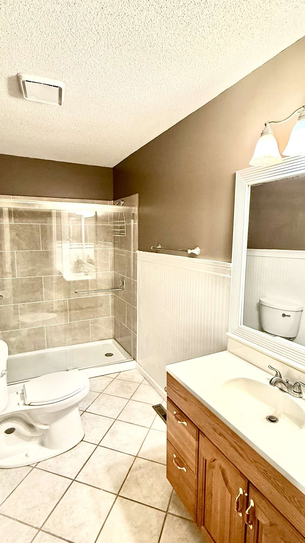 Primary bath with tiled walk in shower, tile floors & single vanity! 645 Wildwood Trace, Winchester, TN 37398