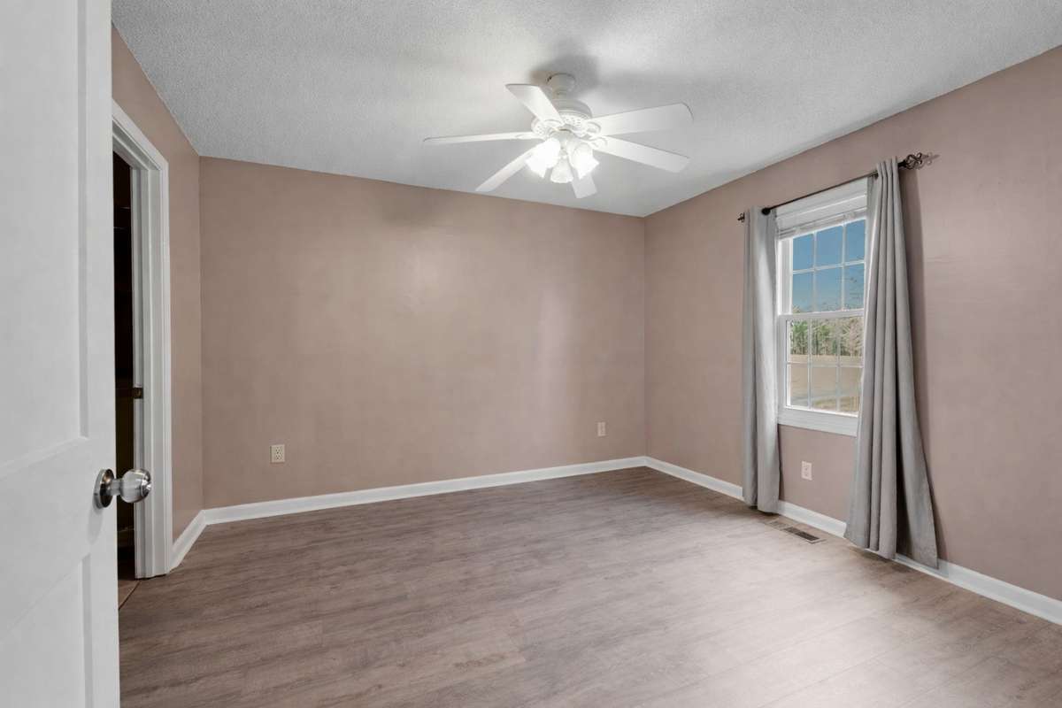 Second bedroom with private bathroom, neutral color scheme & ceiling fan! 645 Wildwood Trace, Winchester, TN 37398