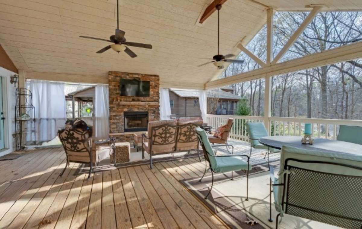 Amazing vaulted ceiling on the covered deck with fans and full on lake views! Stacked stone fireplace means you can enjoy this space year round! 645 Wildwood Trace, Winchester, TN 37398