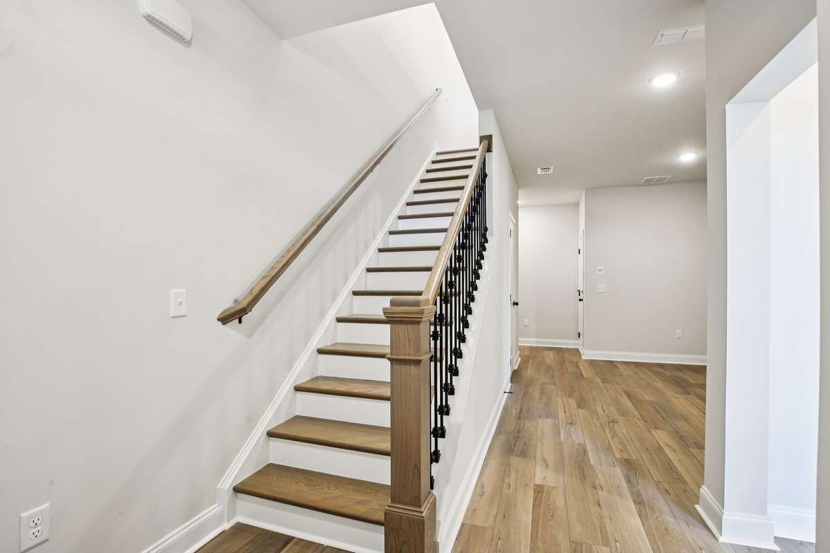 Hardwood stairs are included in your townhouse, adding a touch of elegance and durability as you move between floors.