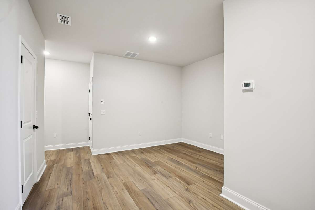 Those working from home will love the lower-level flex space as it provides the perfect spot for a dedicated home office while keeping the main living areas free and uncluttered.