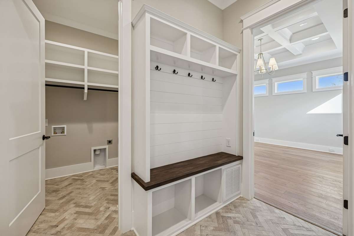 Laundry Room and drop zone are located off the garage entrance.