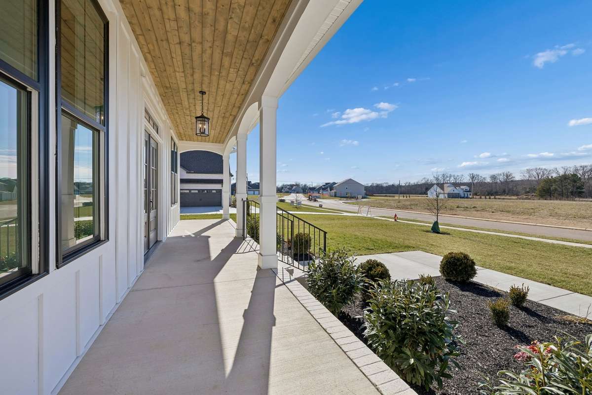 Enjoy the sunsets on this large covered front porch.