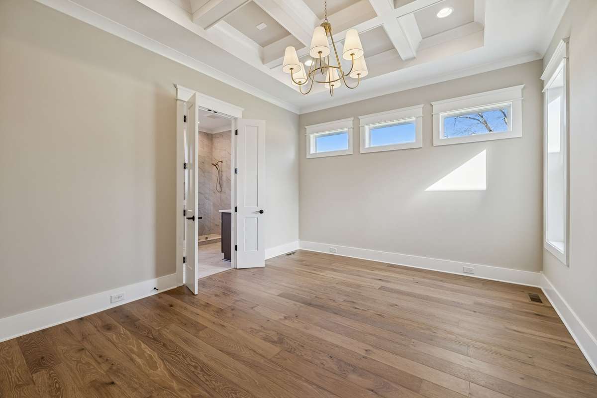 Primary Bedroom With Recessed Coffered Ceiling