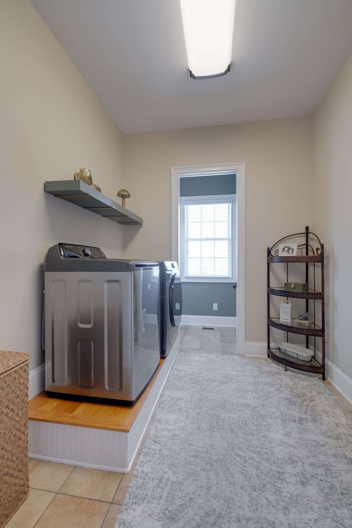 Laundry room and bathroom off the garage right when you when you walk in garage door to wash off those muddy boots from the creek.