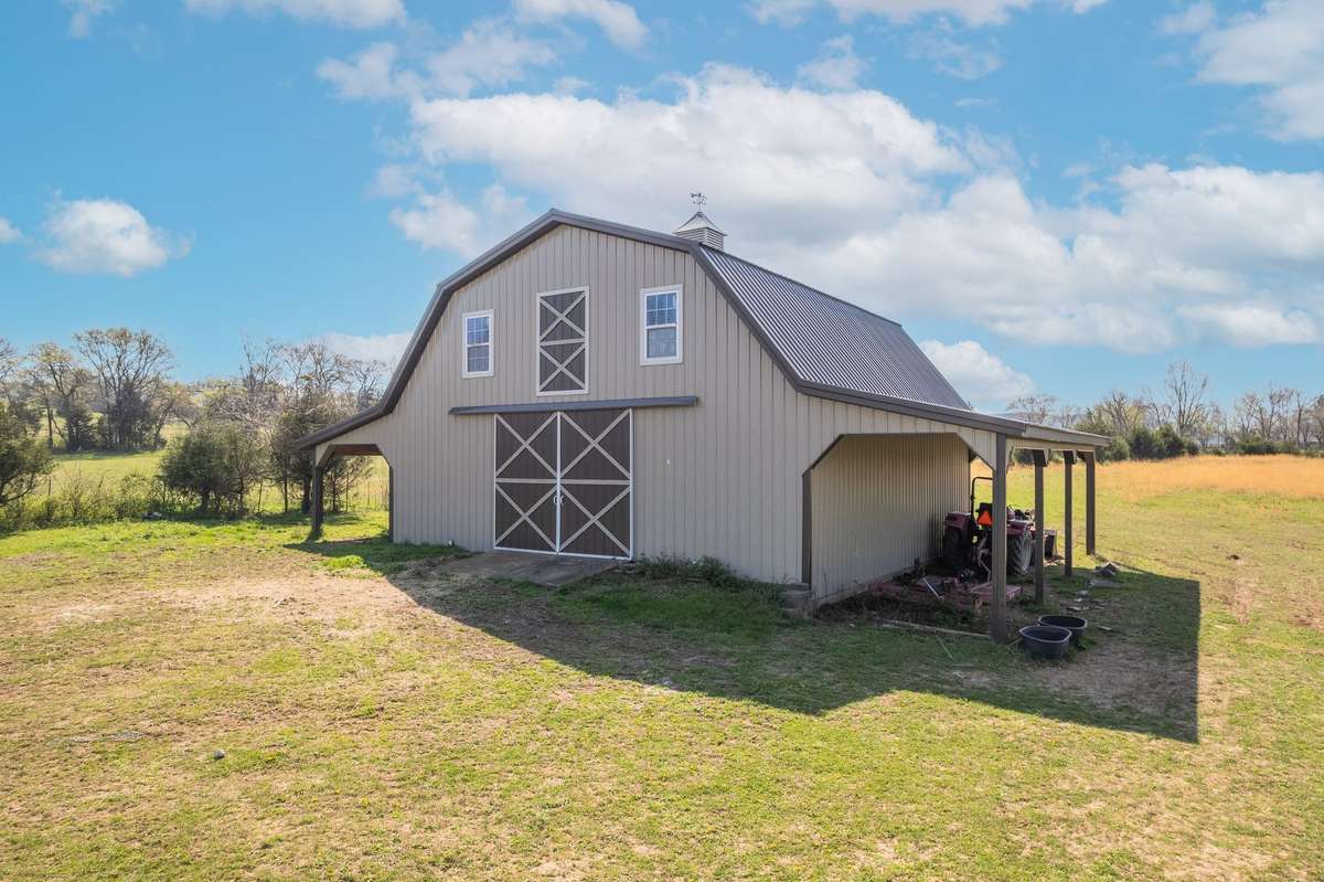 36x36 barn with fenced in pasture surrounding, ready for all your animals