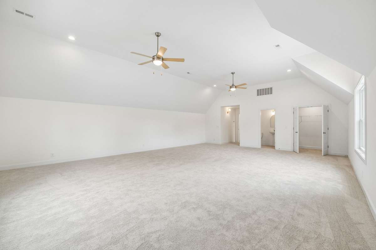 another view of bonus room.  Doors at back of room show the closet and half bath