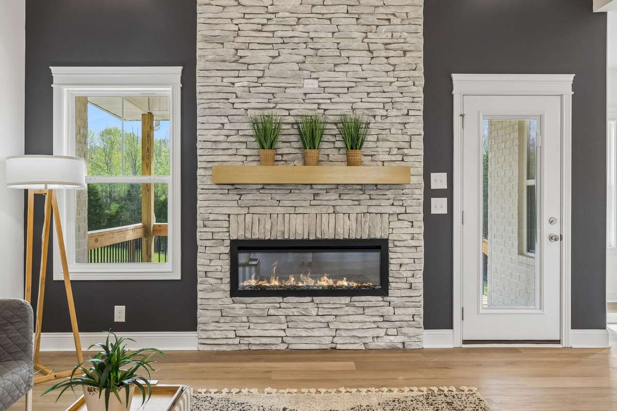 Another view of the beautiful fireplace.  The door on the right leads out to the covered deck.