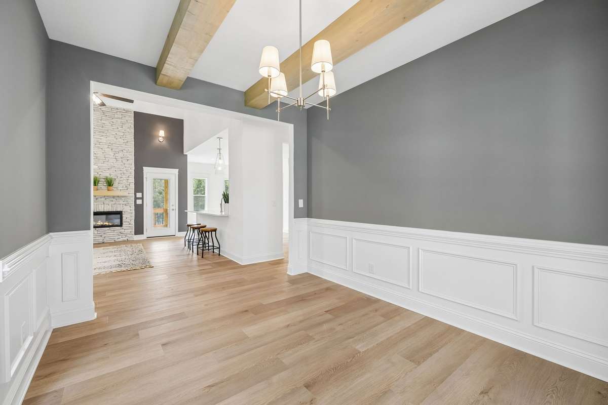 another view of formal dining space showing how it opens to living area and kitchen