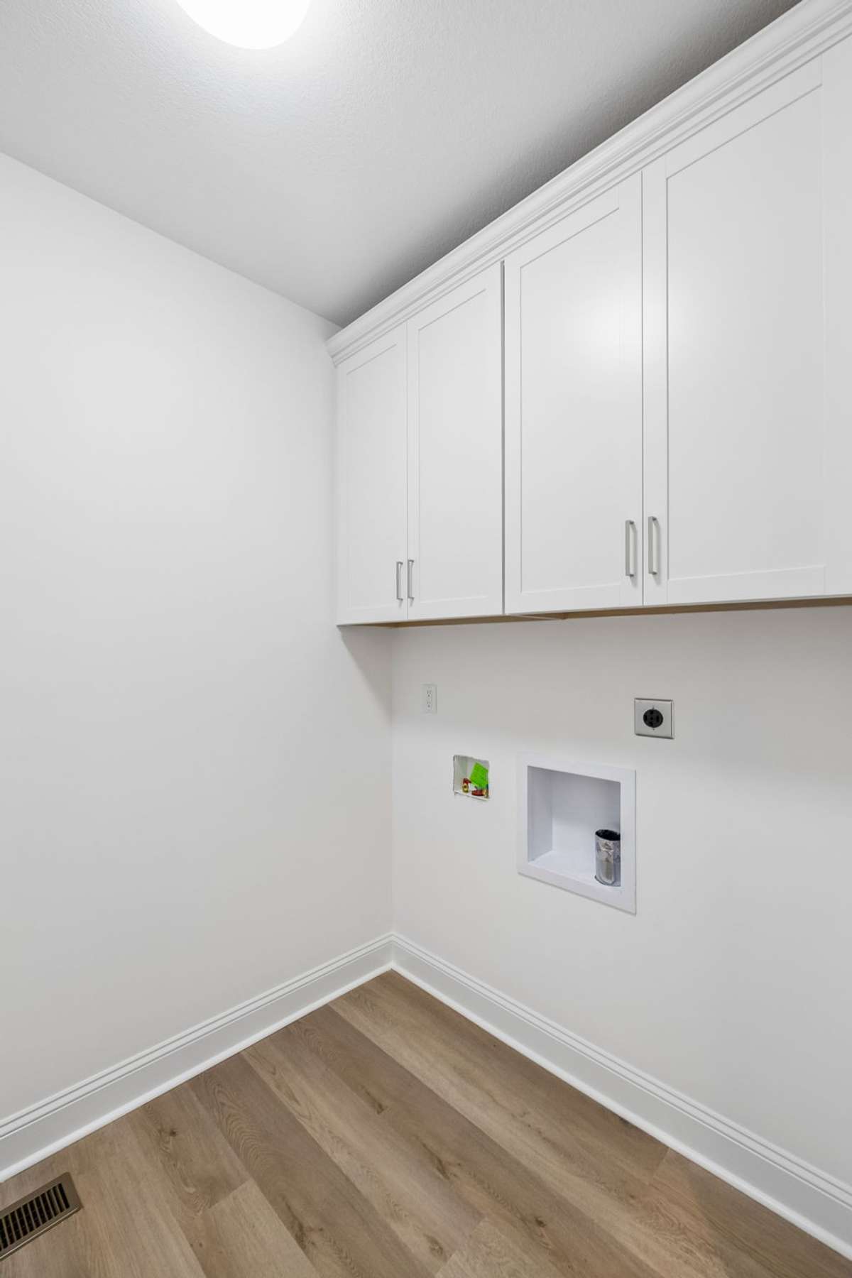 Laundry room with cabinets