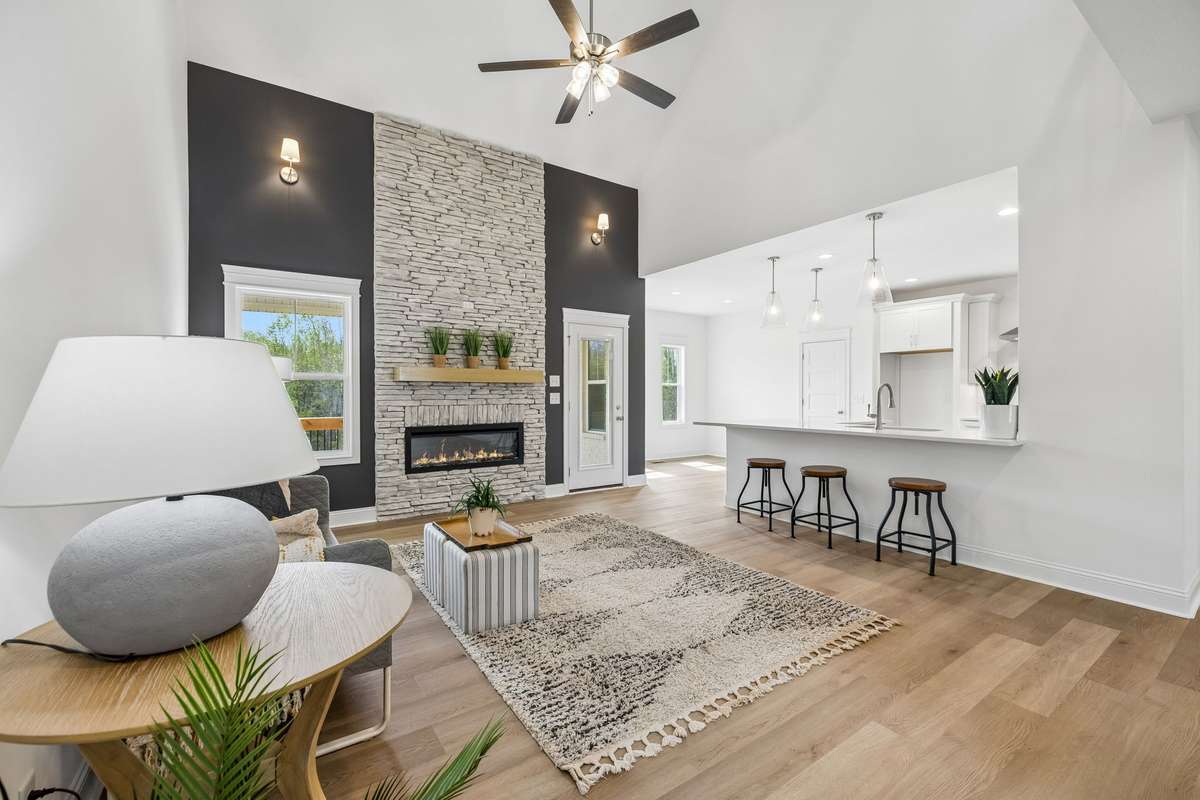 Another view of great room. Beautiful stone fireplace with electric fireplace insert