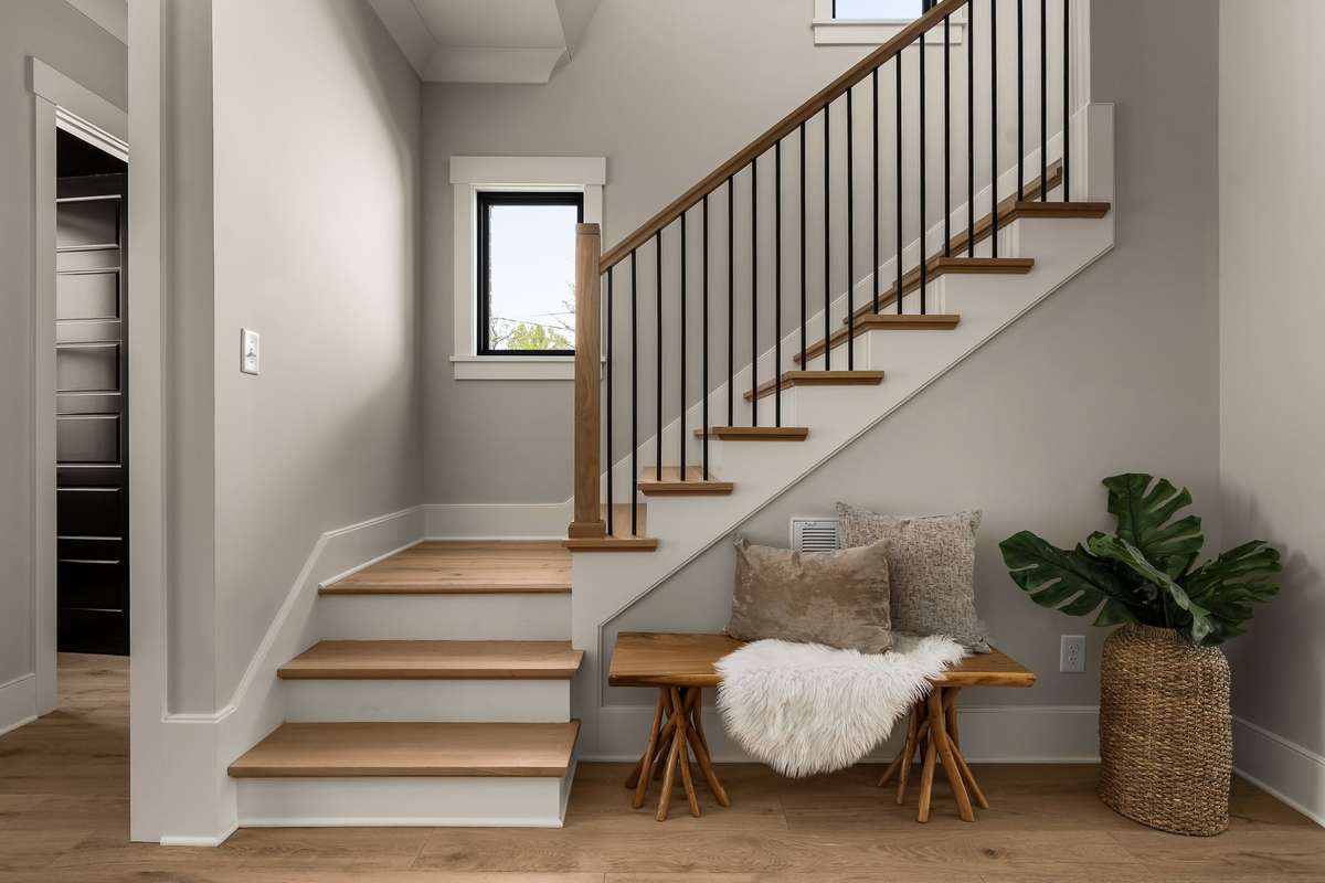 Stairs leading to the three bedrooms upstairs