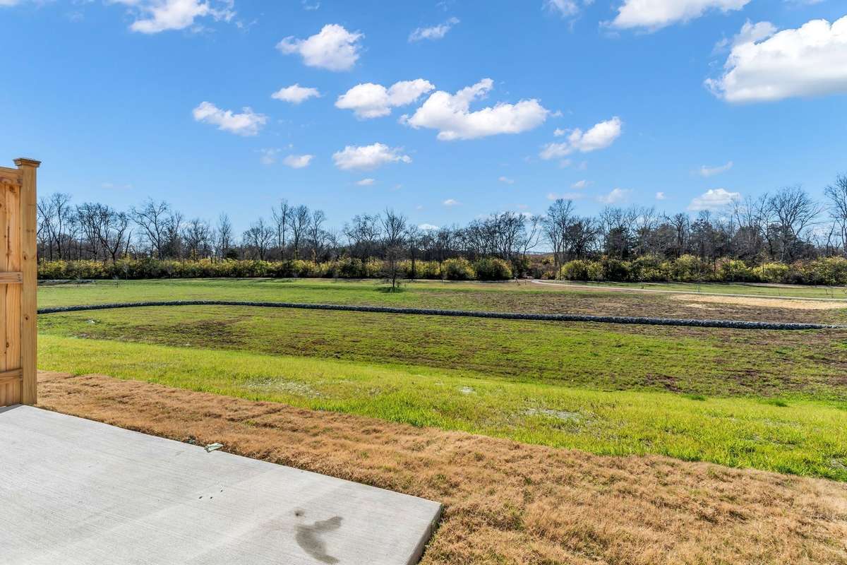 One of our EXCLUSIVE home sites backing to 3 acres of open space, with a sidewalk path down to our creek access!  Enjoy privacy, convenience and views!