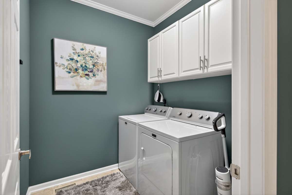 A real laundry room with storage, and on the main level!