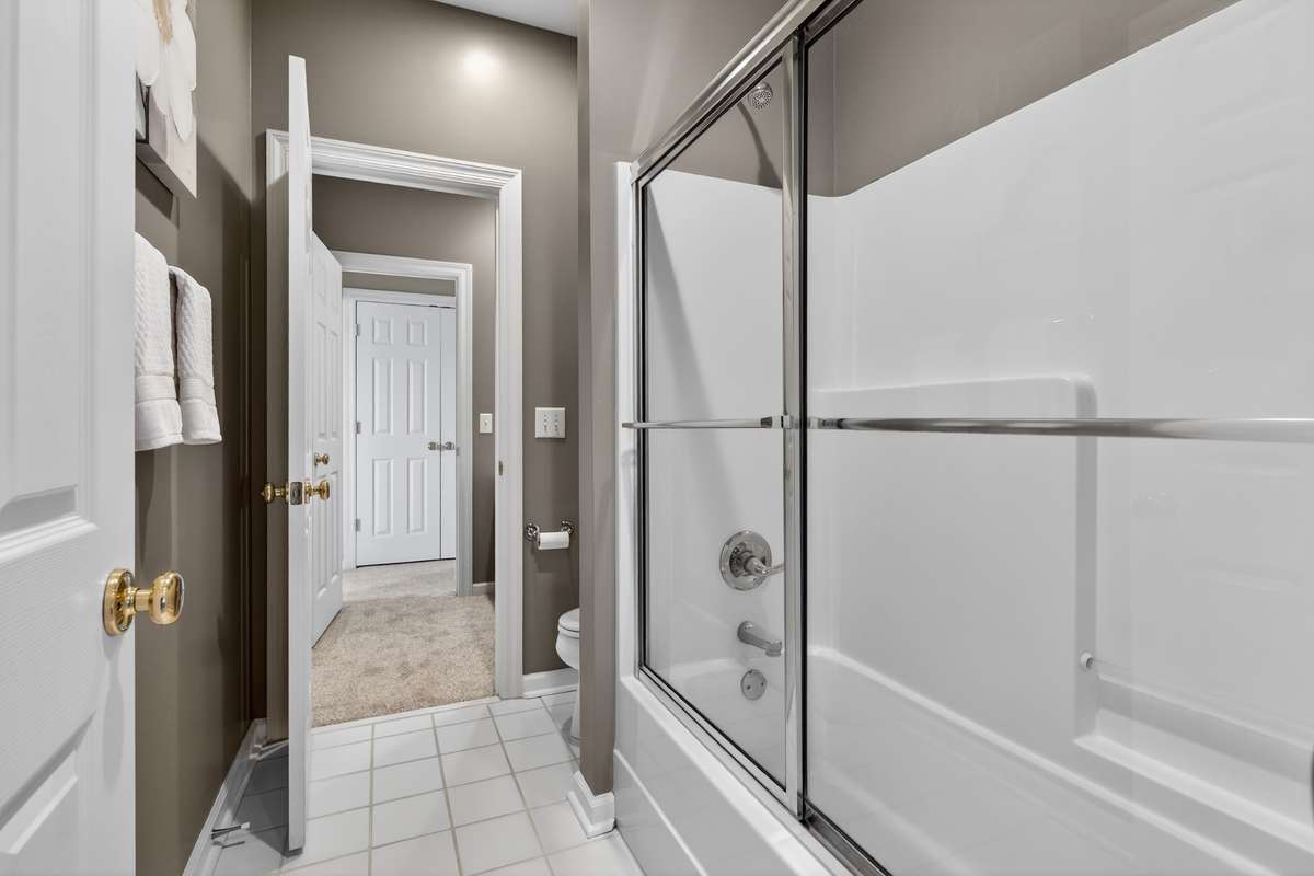A tub/shower combo and storage.