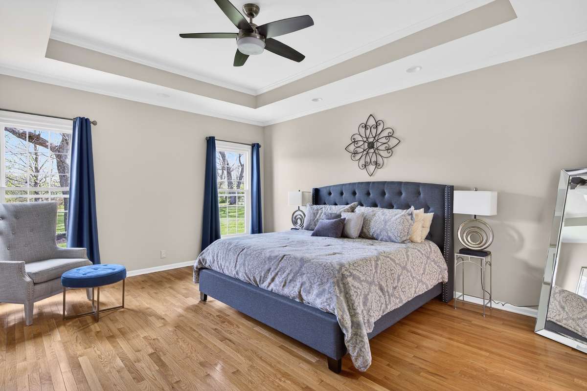 The large room has beautiful natural light, trey ceilings, and hardwood floors.